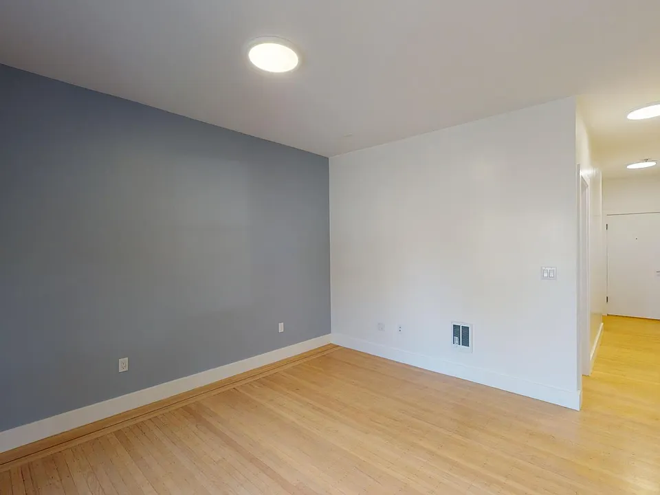 Living area with a wood-like flooring