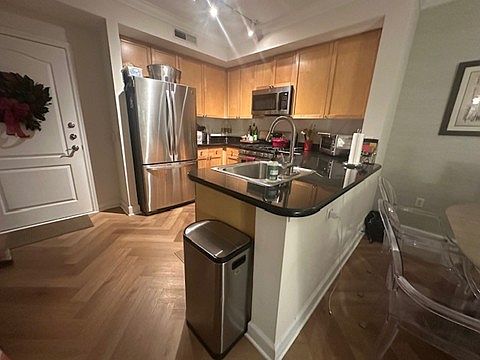 Large kitchen with ample storage, dishwasher, microwave and garbage disposal