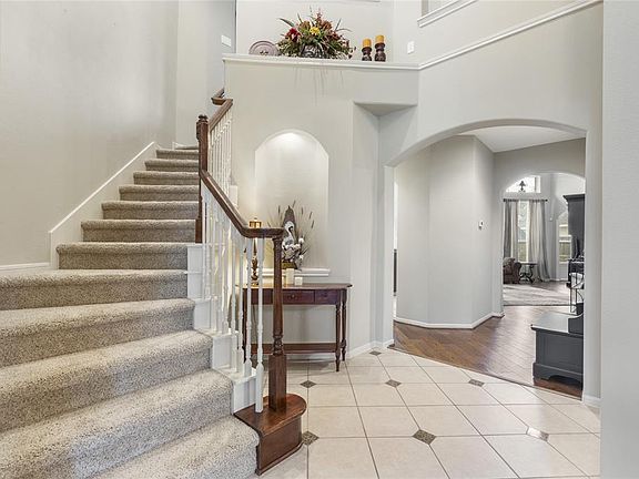 Gorgeous staircase with decorative art nooks