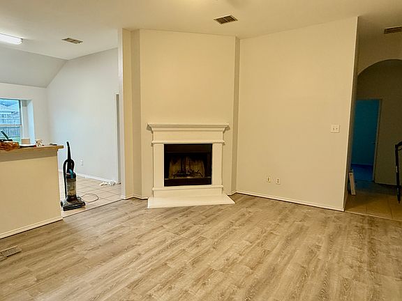 New paint, new flooring, fireplace painted