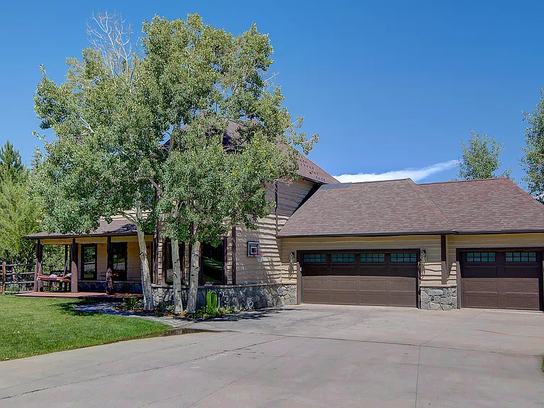 3-car garage with lots of driveway parking