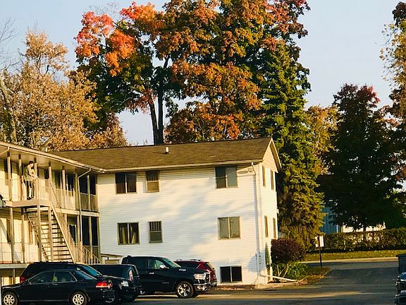 Exterior of building. End units back up to residential road.