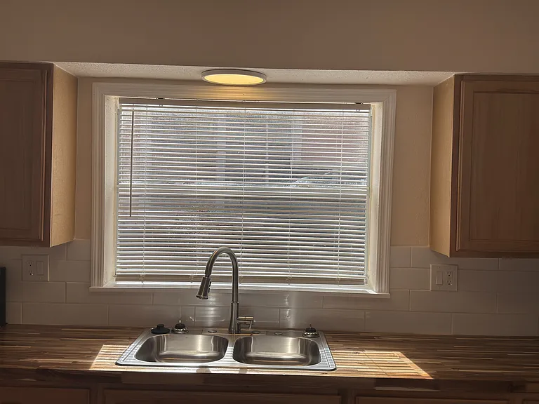 Kitchen with large window and Classic White Subway Tile