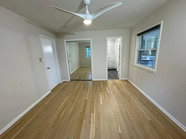 Primary upstairs bedroom with attached bath.