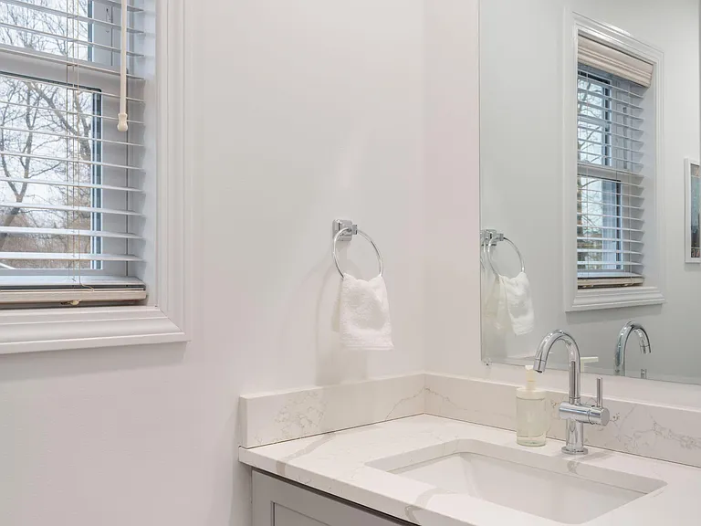 Shared half bath conveniently located off the living room area.