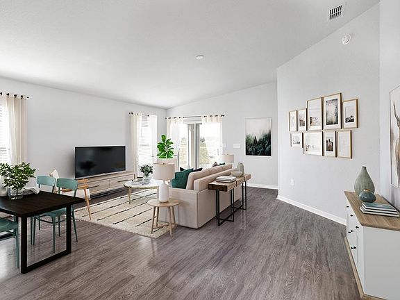 Enjoy a spacious and open living area with volume ceilings - Cambry home plan by Highland Homes