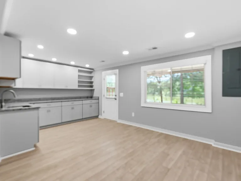 Lower Level Recreation Room with Wet Bar and Cabinets