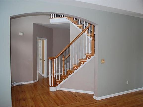 Eat in kitchen looking to the large family room featuring a fireplace