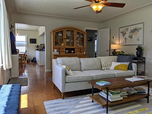 Living room with Dining/Hallway in background
