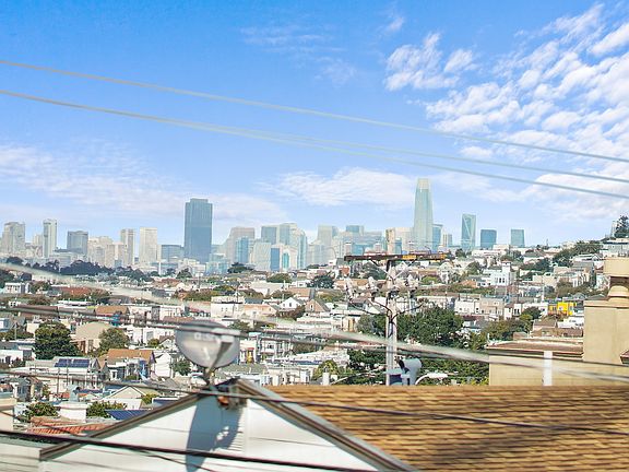 Panoramic views of neighborhood, Sutro Tower, downtown city skyline, including Salesforce Tower.