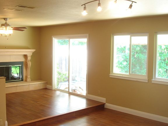 Living and family rooms with new ceiling fan.