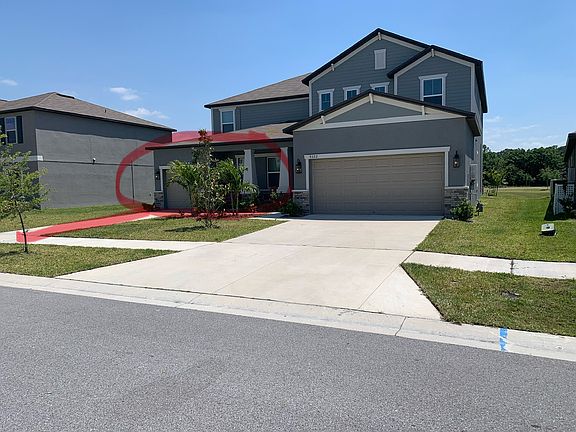 Suite has separate entrance, garage and driveway (highlighted in red).