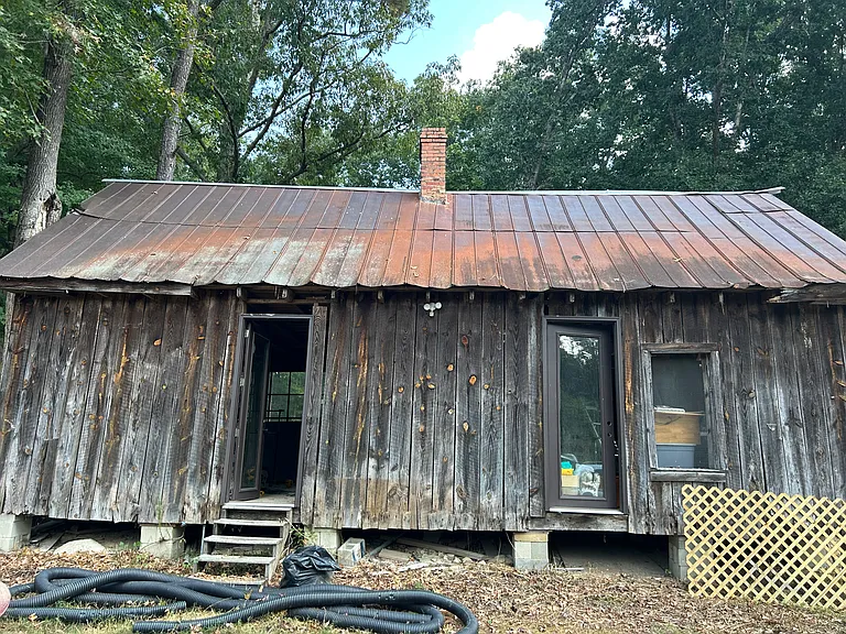 1920s homestead storage and workshop. 900 square feet inside with two covered stalls