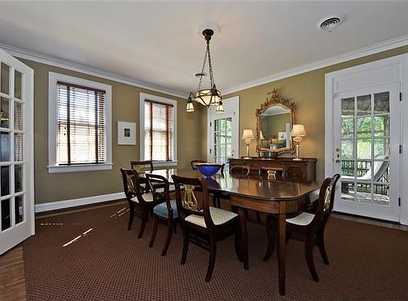 French Doors lead to Private Screened Porch