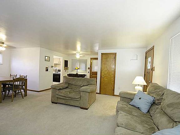 Open plan with adjacent dining room.