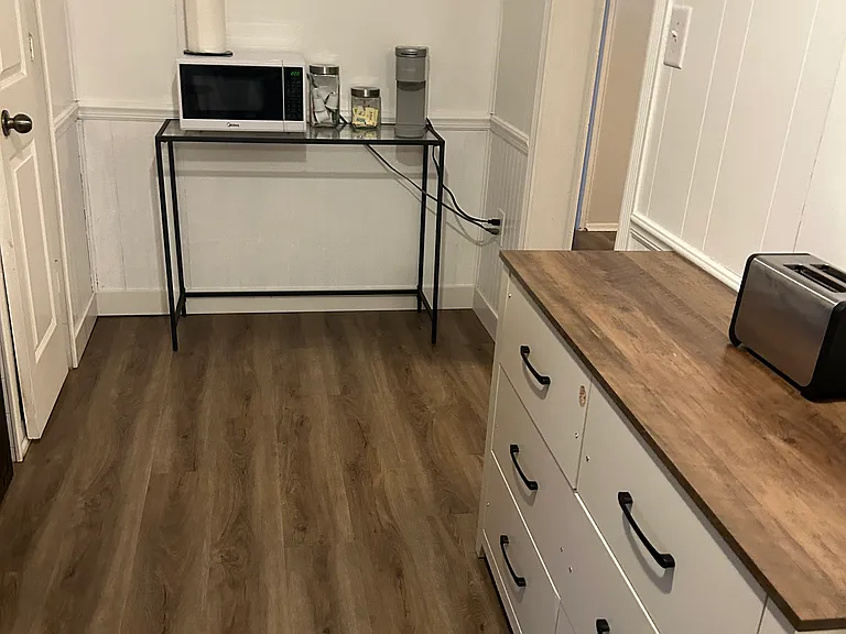 KITCHEN WORK SPACE AND ADDITIONAL STORAGE; MICROWAVE, COFFEE MAKER AND TOASTER