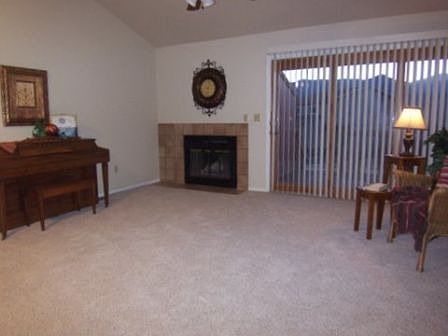 Large, Vaulted Living Room with Fireplace and Walkout to Deck with Views