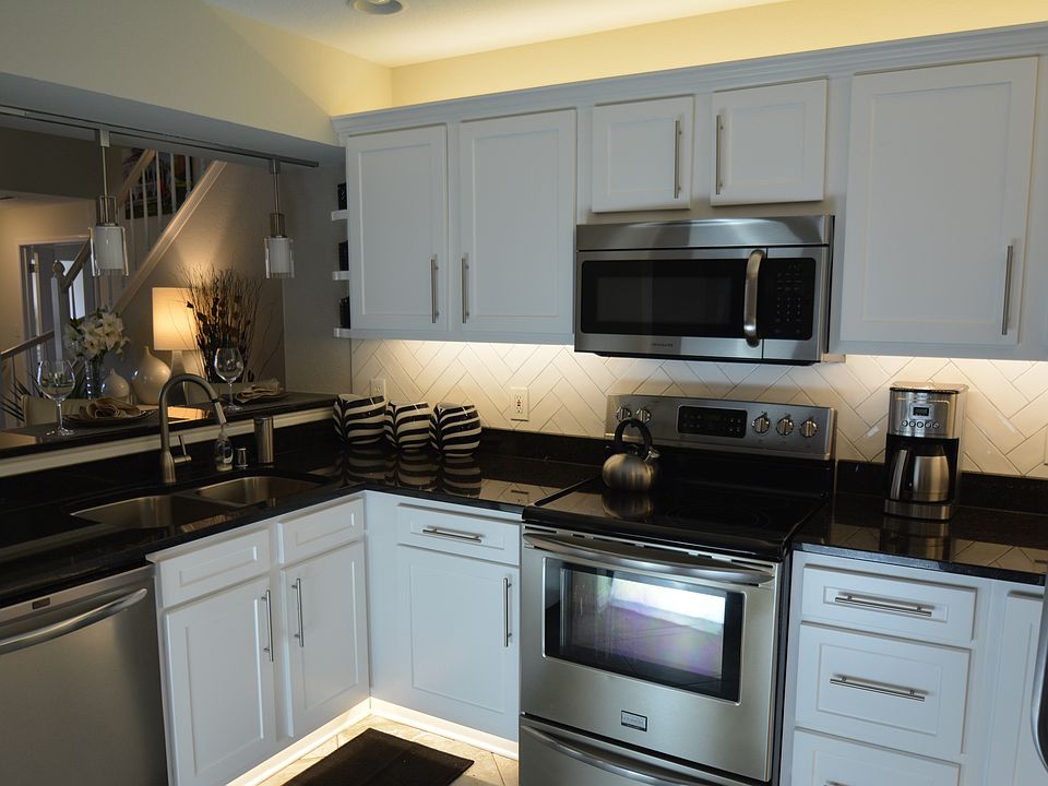 Select kitchens have tile backsplash and under & over cabinet lighting