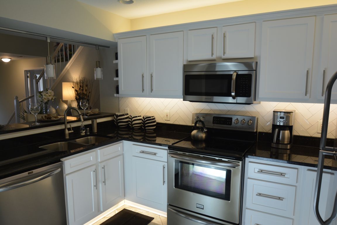 Select kitchens have tile backsplash and under & over cabinet lighting
