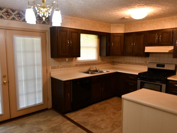 Kitchen with patio door out to deck