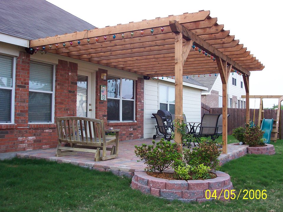 12' x 19' brick pavers patio with cedar pergola and beautiful circular planter