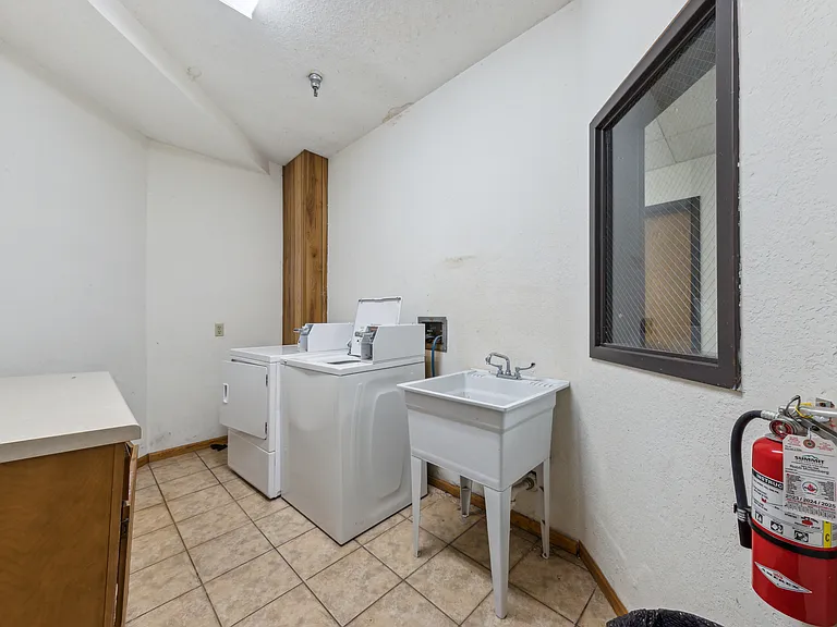 Laundry room just down the hallway.