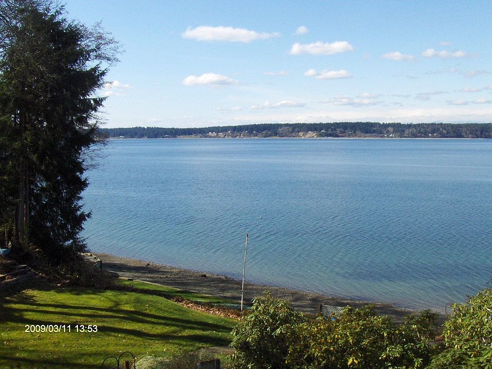 Low bank, western facing waterfront with easy path to beach.