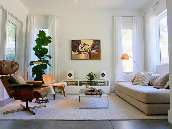 Open-concept living area with views toward the screened porch.