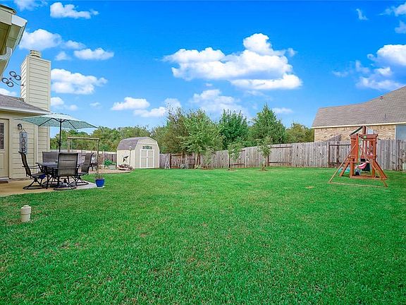 Great backyard with plenty of space for gatherings or a little gardening with your own vegetable garden. Nice storage shed to stay on property.