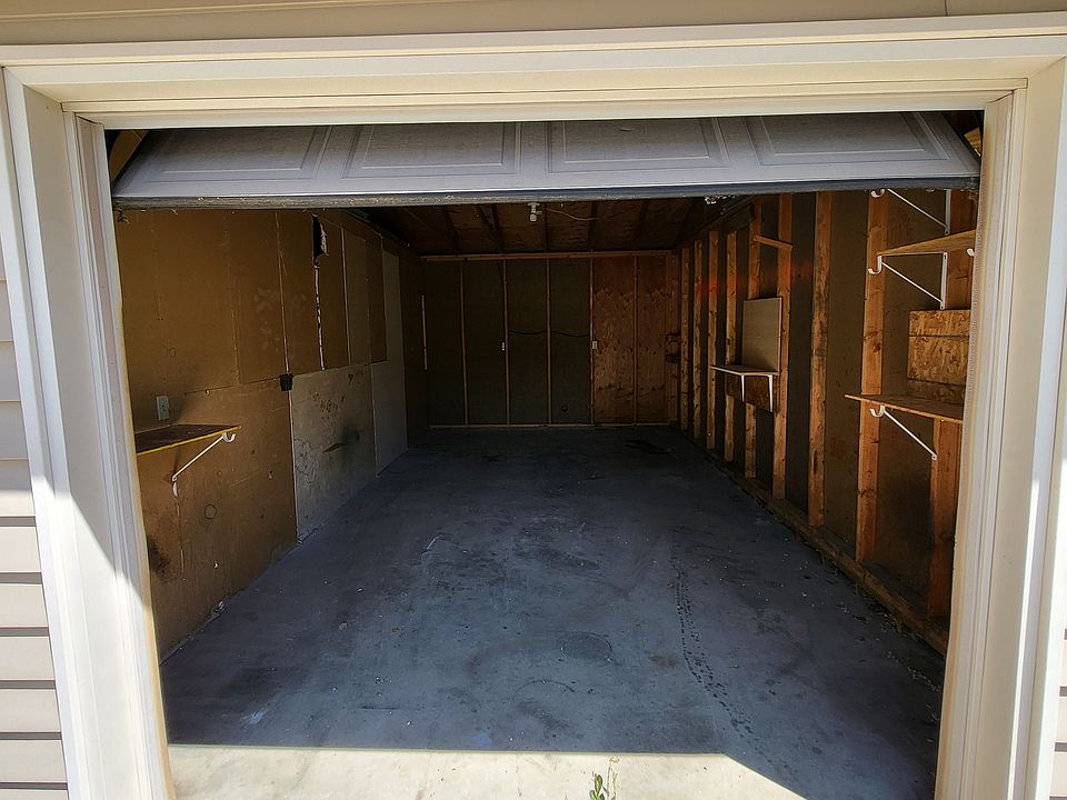 One car garage with electrical outlets.
