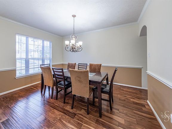 Plenty of space in this formal dining room, and the chair moulding add the perfect touch.