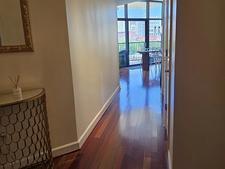 Front entry with new wooden flooring and additional lighting
