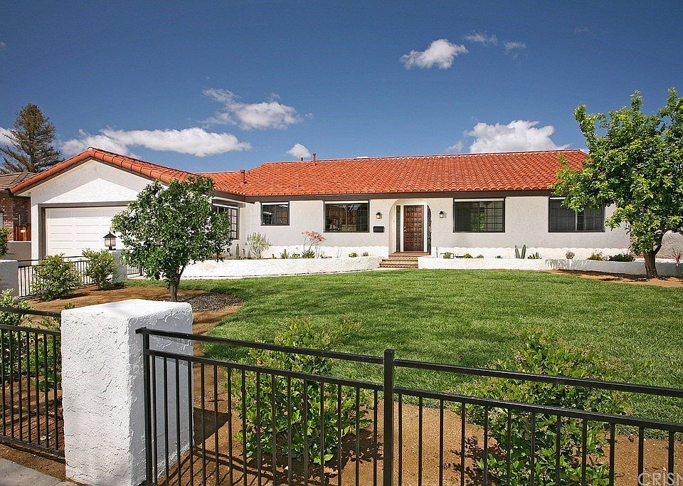 This beautiful home with Spanish flair was complet