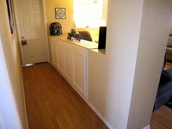 Notice built in pony wall cabinets.