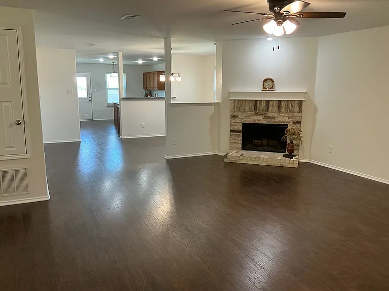 Open floor plan. Plank flooring in living, dining and kitchen areas