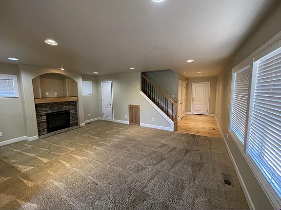 Great room with gas fireplace, good natural light.