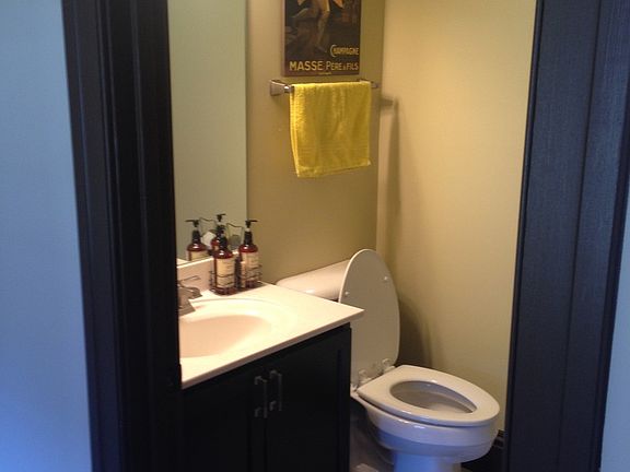 Powder room on the first floor between the kitchen and dining room