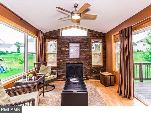 Four season porch with access to large deck. Four season porch has many windows to allow the sunligh