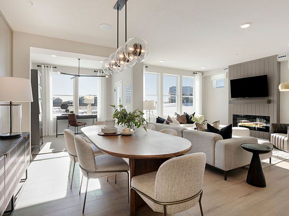 Standing in the Dining Room, Gazing Into the Gathering and Sunrooms