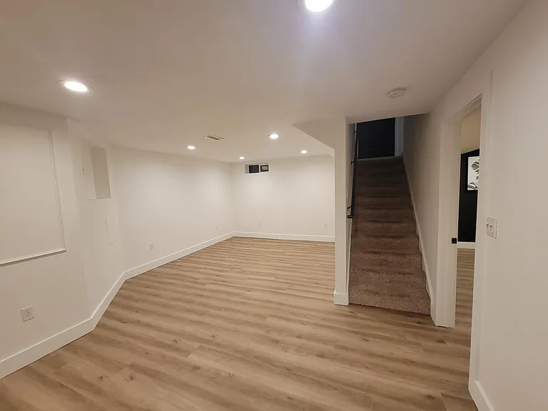 New laminate floors & fresh paint & trim in the large, finished basement