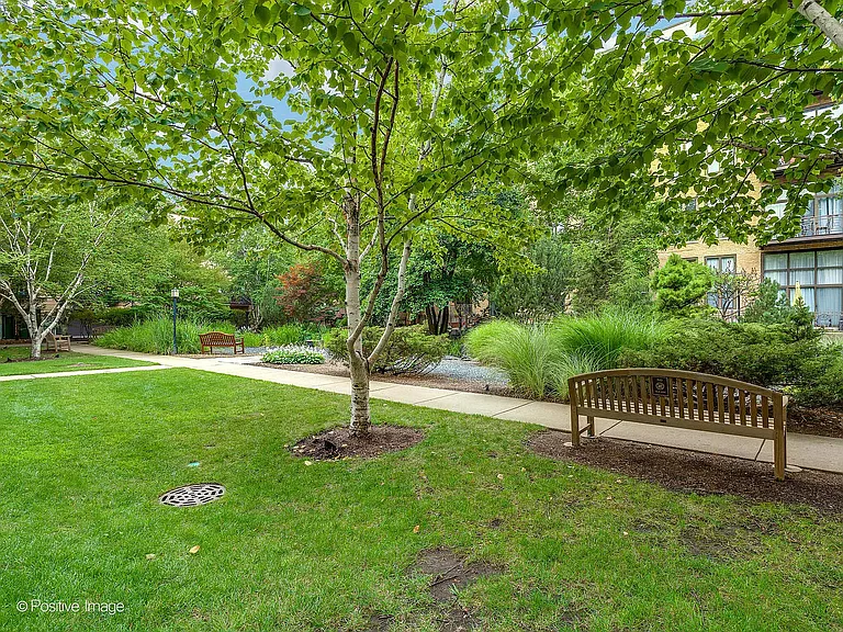 Enjoy the coveted tranquil Block Y courtyard with walking path, benches and serene koi pond