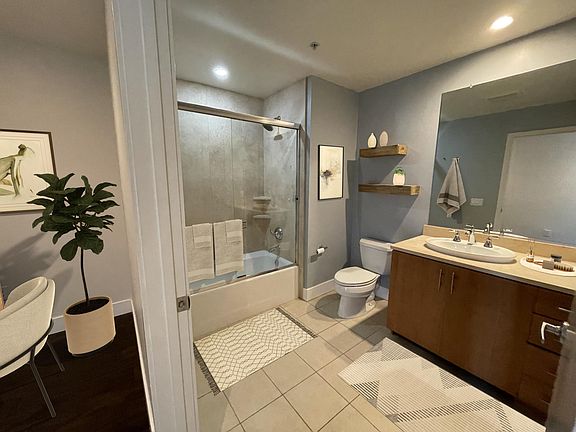 large bathroom with tile and soapstone