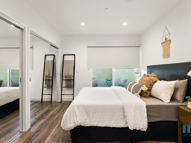Bedroom with Mirrored Closet, Vinyl Flooring, and Recessed Lighting