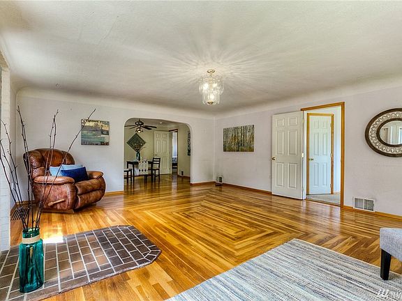 The living room includes a designated area to add a wood stove if desired. 