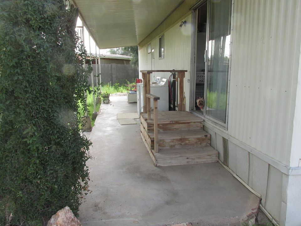 Washer and Electric Dryer hookups on north side of home under awning. You provide your own machines.