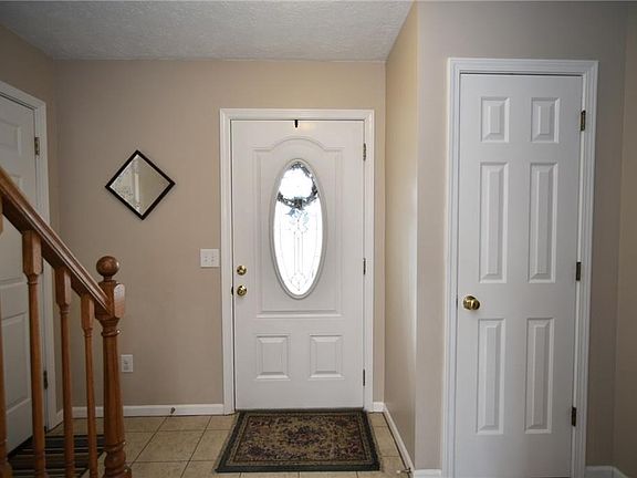 Neat and clean entry way with coat closet.