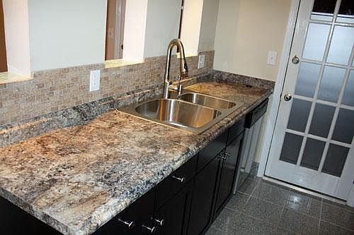 Upgraded countertops, double-basin sink, pull-down faucet, a