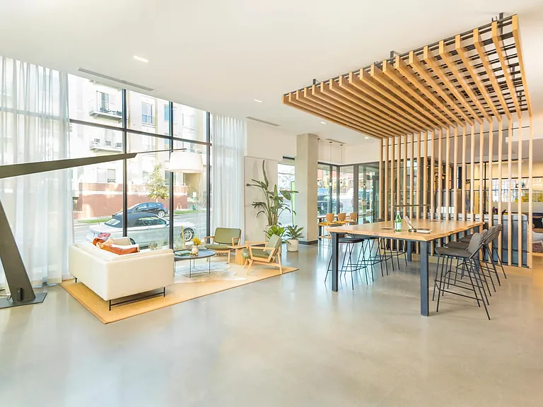 Lounge with work from home conference table and complimentary WiFi.