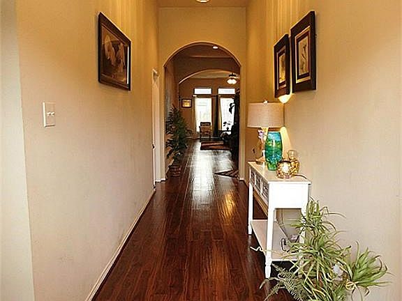 As You Enter This Lovely Home You Find Yourself In A Custom Built Perry Home With Arched Doorways That Greet You Thu-Out The Home. This Picture is The Beginning Of Your Entry To A Home You Would Be Proud To Call Yours. Low Maintenance Backyard.