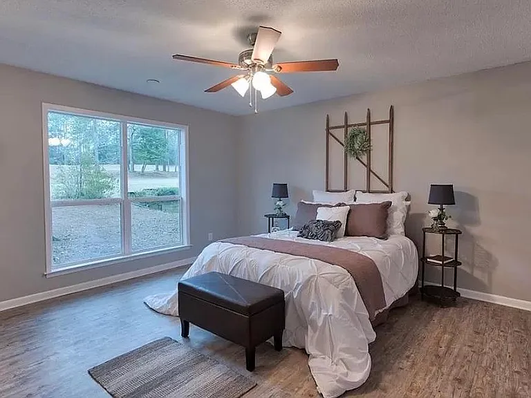 Master bedroom with great view of backyard and golf course